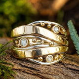 Celestial Gold Wave Ring with Sparkling Stars