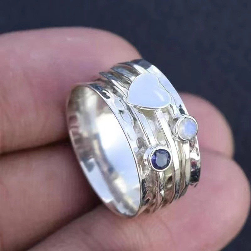 Hammered Heart Spinner Ring with Blue Gemstone Accents