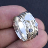 Hammered Heart Spinner Ring with Blue Gemstone Accents