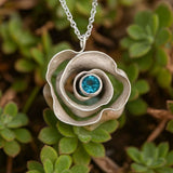Blooming Rose Pendant with Blue Gemstone Centerpiece