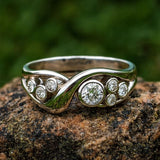 Nature Inspired Infinity Band with Multiple Bezel Set Crystals