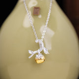 Golden Fruit Amulet – Enchanted Vine Pendant