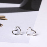 Minimalist Open Heart Stud Earrings in Polished Silver
