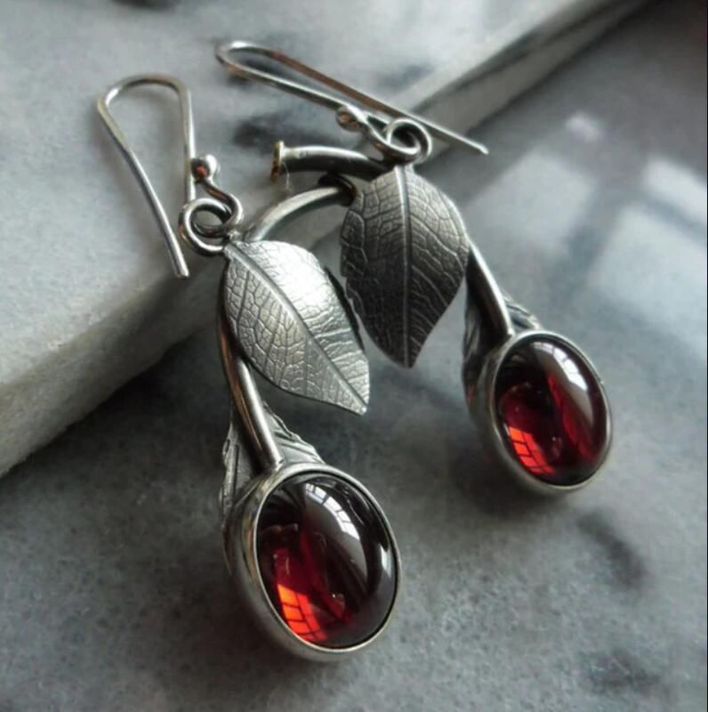 Nature Inspired Leaf Drop Earrings with Red Gemstone Glow