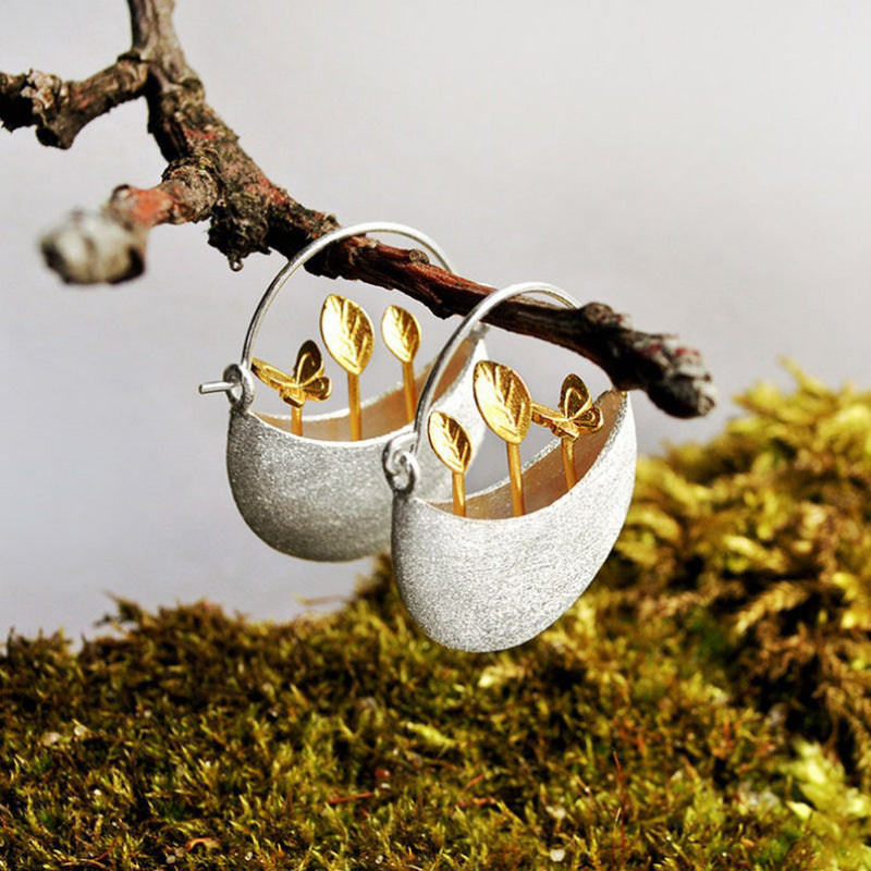Silver Moon Bowl Earrings with Golden Leaf Sprout Design