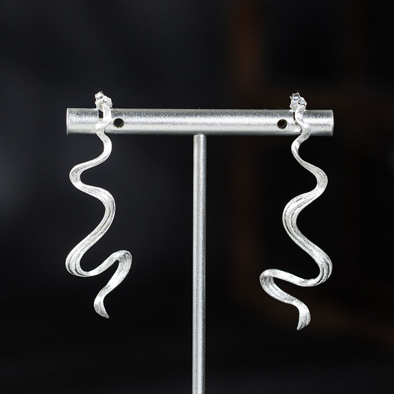 Wavy Silver Drop Earrings with Abstract Snake Energy