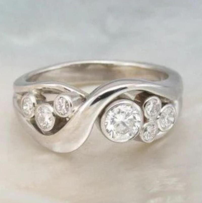 Nature Inspired Infinity Band with Multiple Bezel Set Crystals