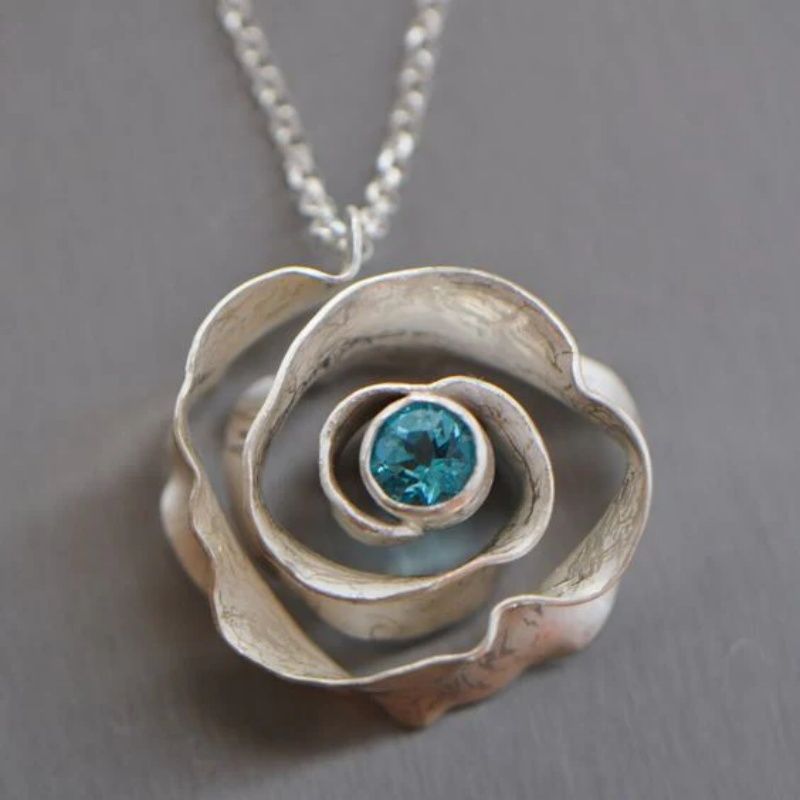 Blooming Rose Pendant with Blue Gemstone Centerpiece