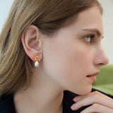 Sacred Pearl Drop Earrings with Mystical Scrollwork Charm